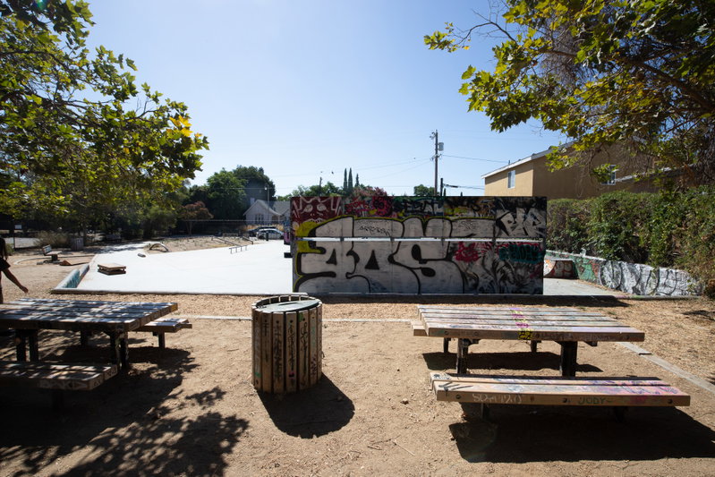 The skate park is visible from the street.